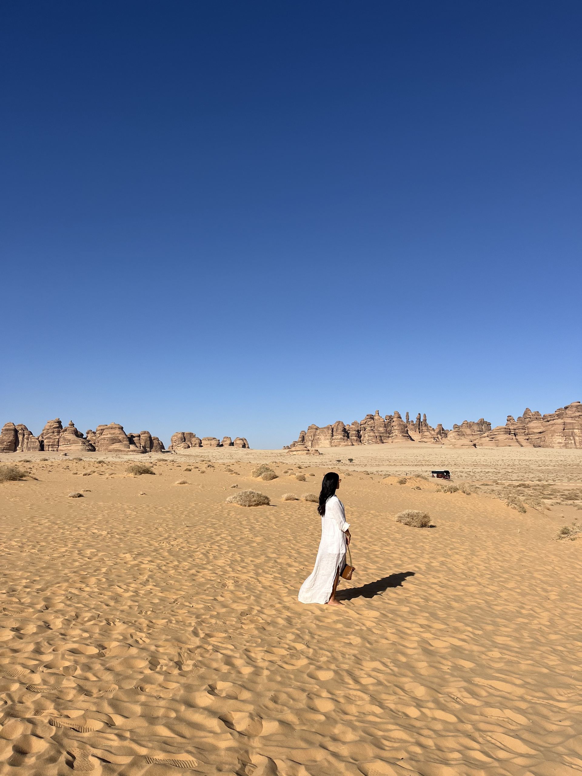 Traveller in AlUla during Ramadan, dressed respectfully for the desert climate.